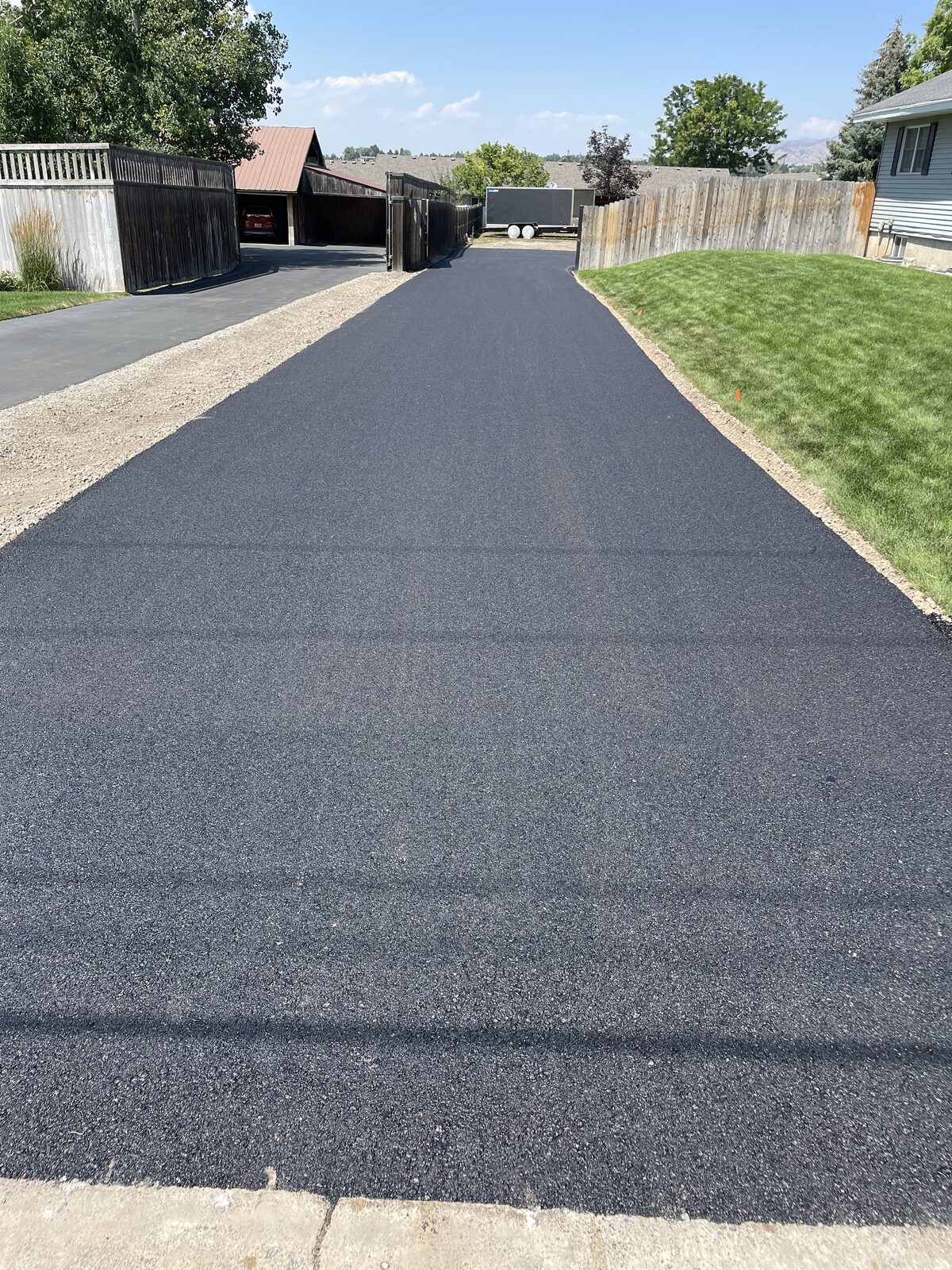 3H Paving crew repairing and finishing an asphalt driveway in Utah during the fall season